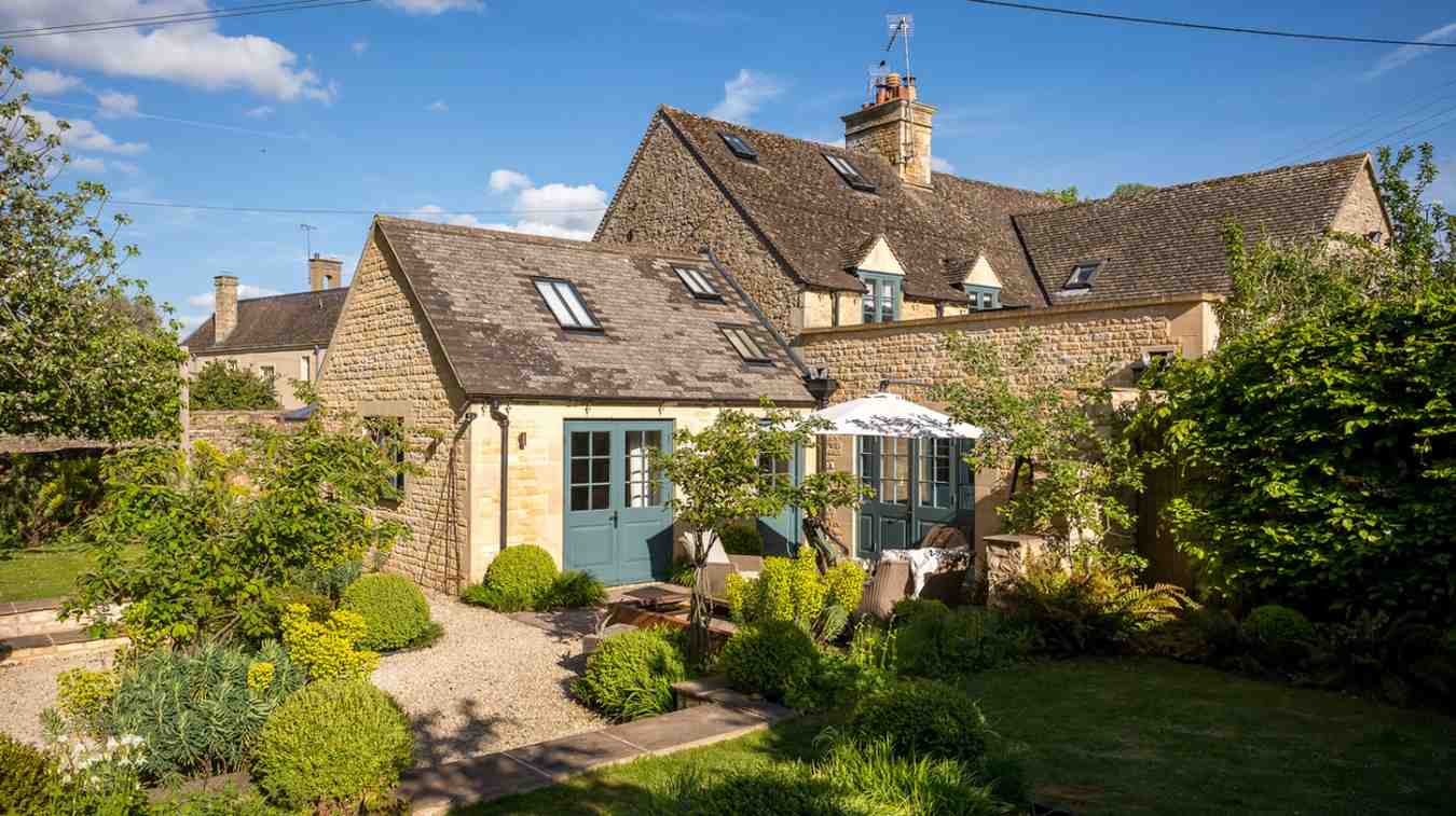 Luxury countryside cottage surrounded by landscaped gardens