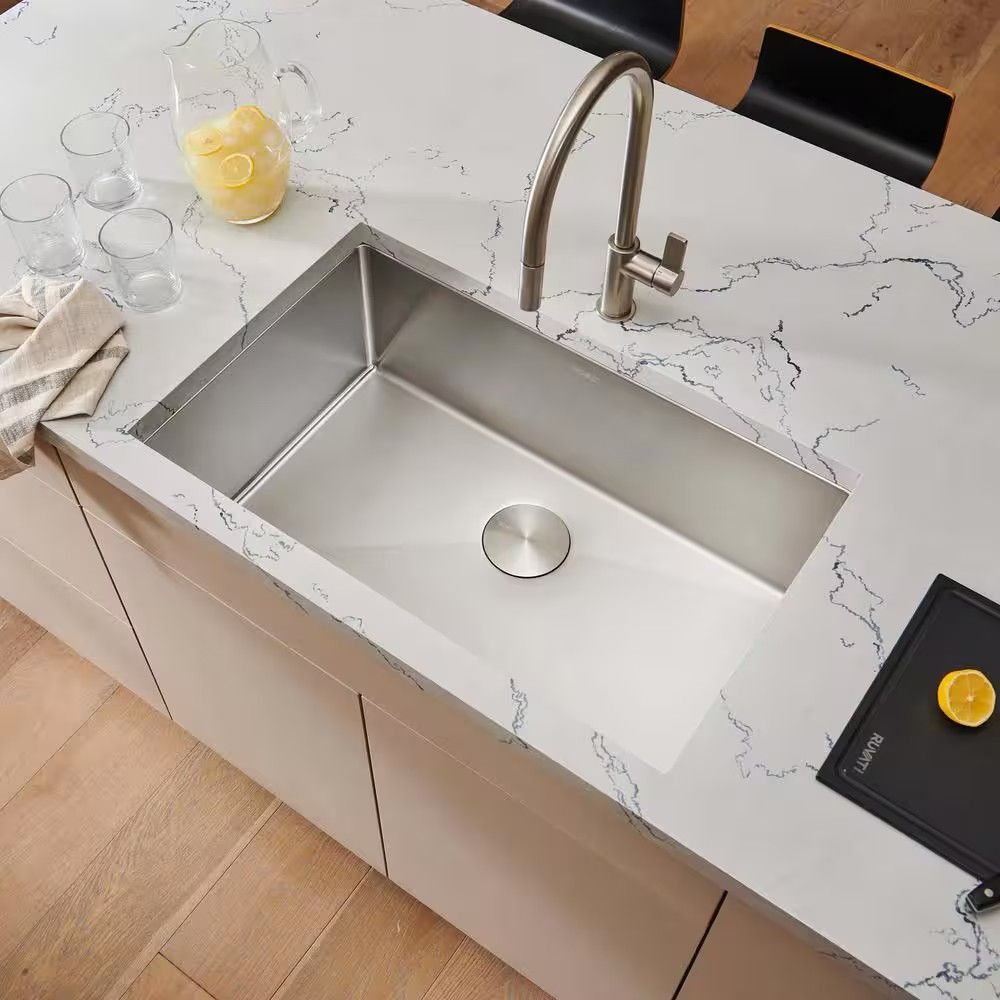 Matte black granite composite kitchen sink with a single deep bowl